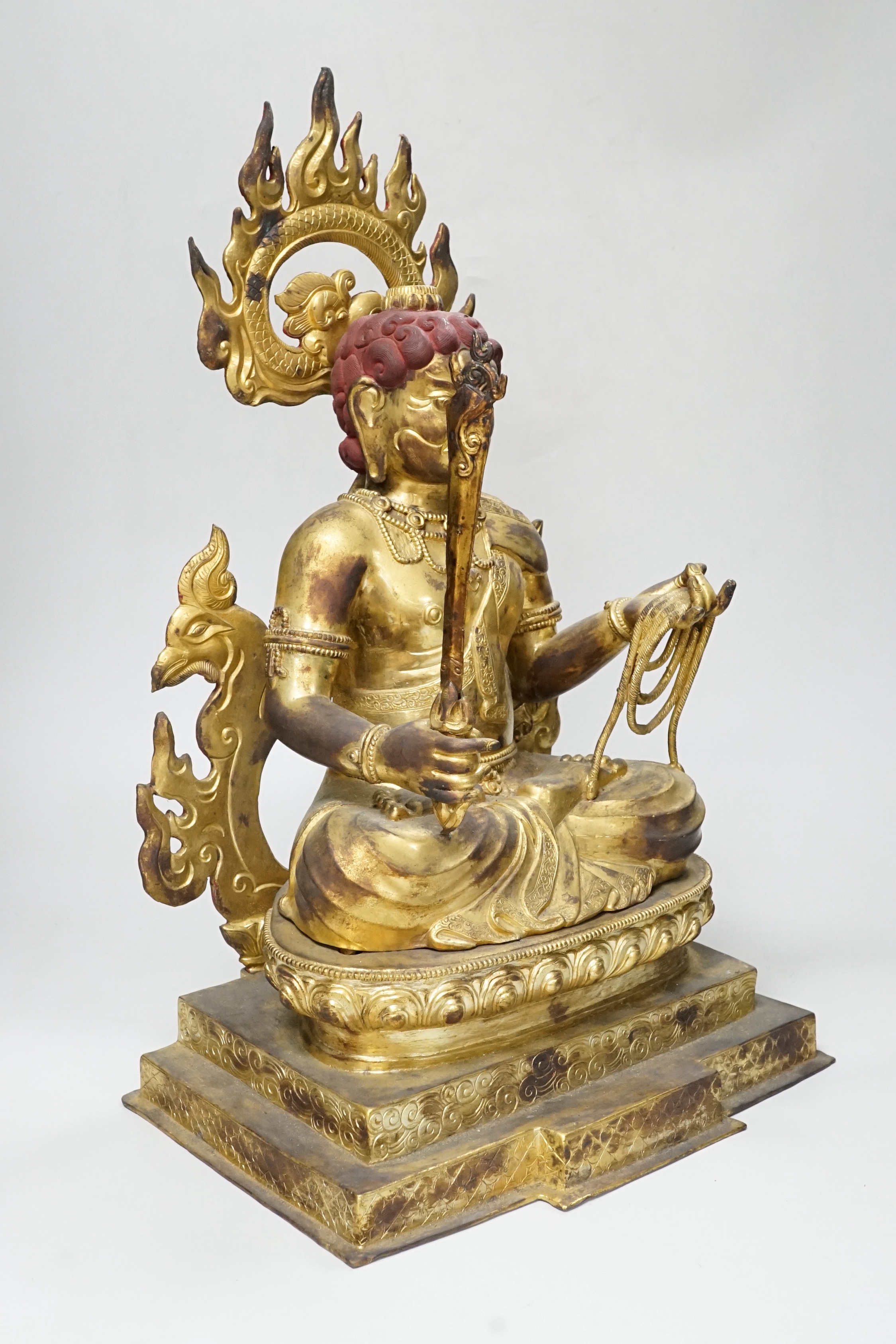 A large Sino-Tibetan gilt bronze figure of Fudo Myob (Acala), 44cm high